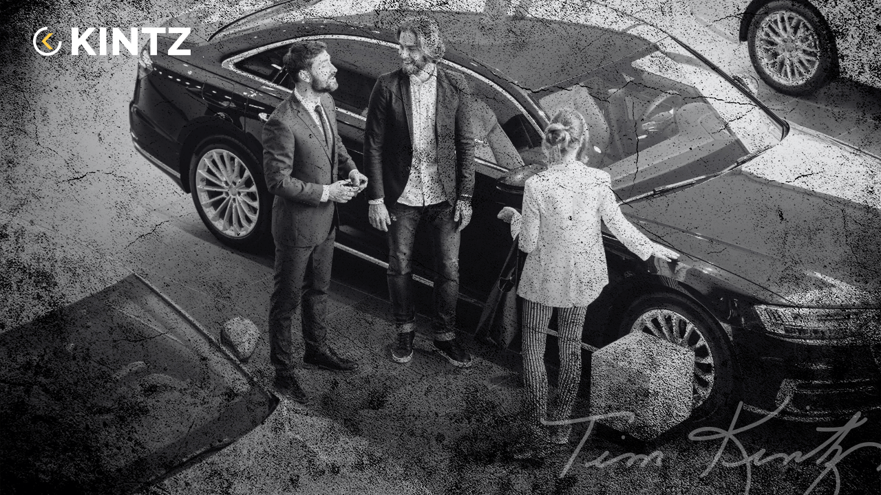 Car salesperson training with clients in a dealership